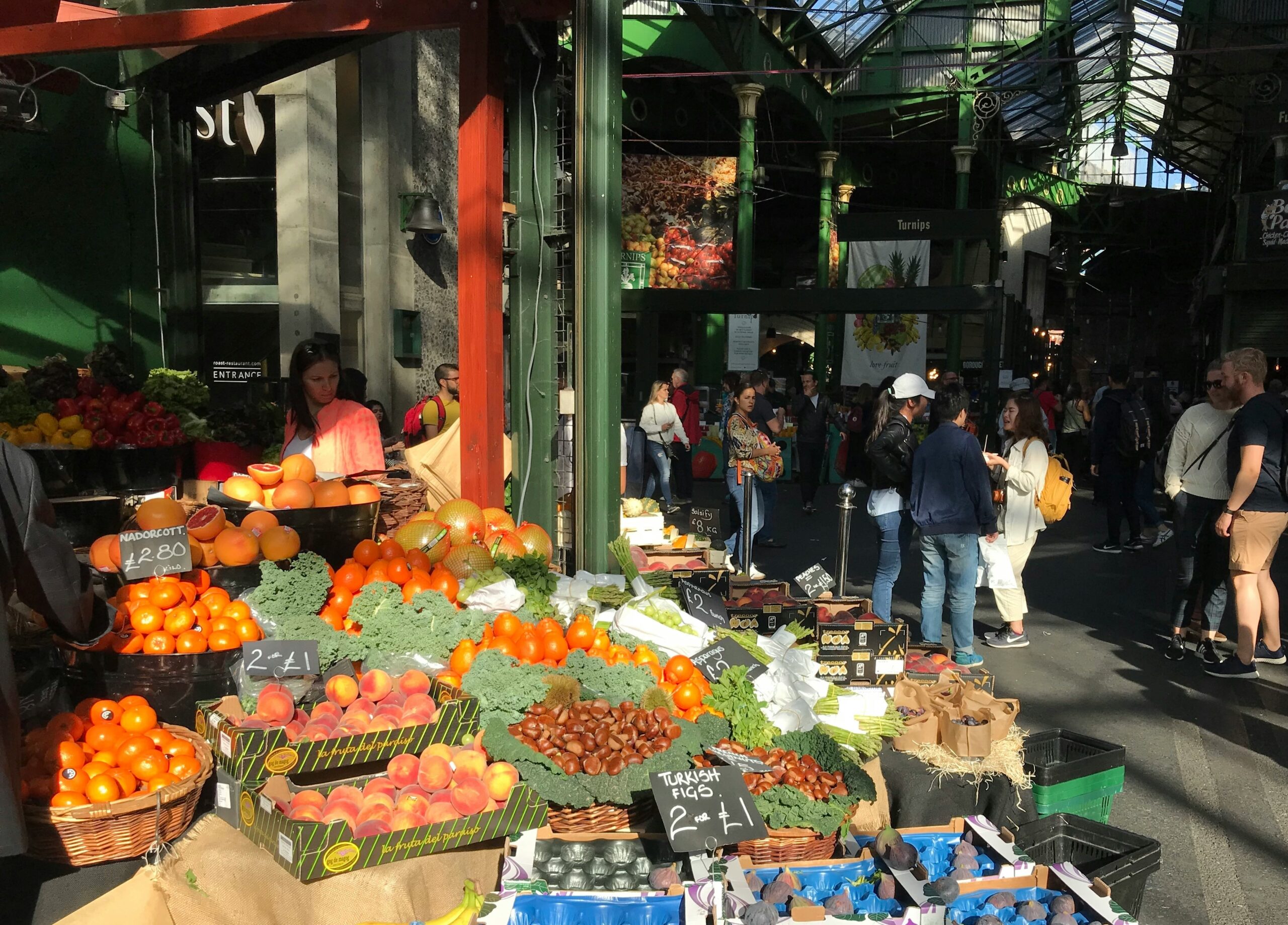 A vibrant farmers market stall showcasing fresh organic vegetables under sunlight