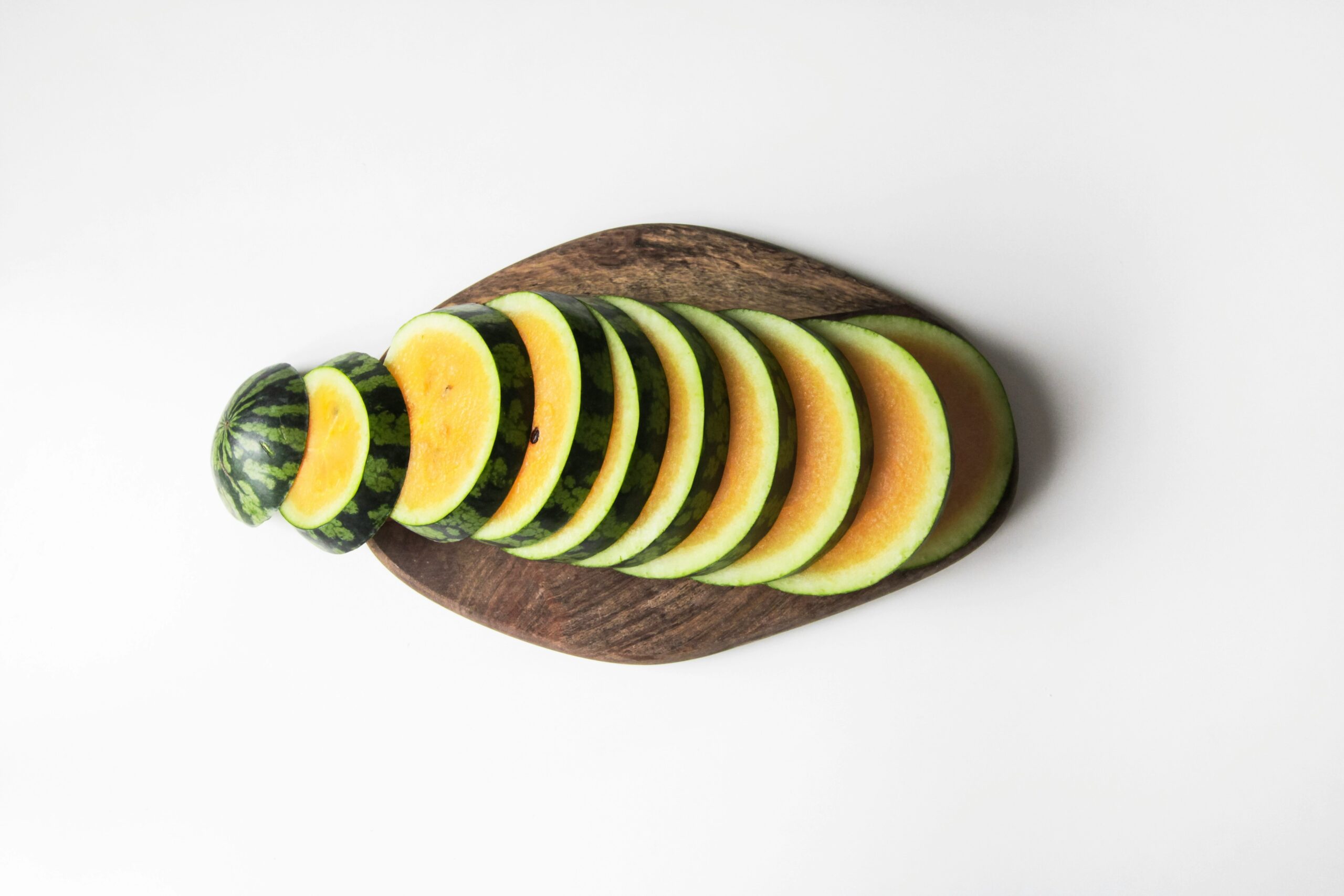 DIY skincare setup featuring avocado mask and cucumber slices