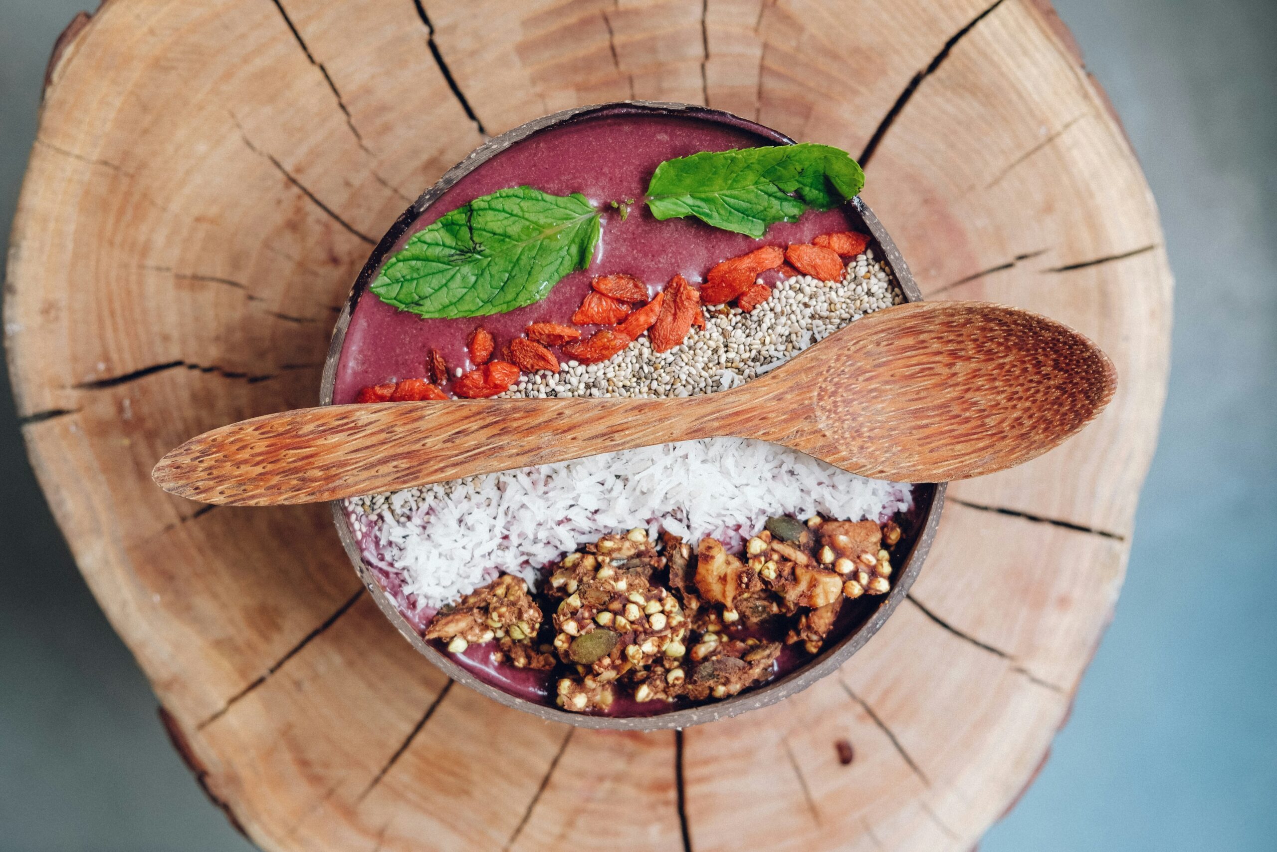 A hearty quinoa bowl topped with roasted vegetables, chickpeas, and a drizzle of tahini sauce.