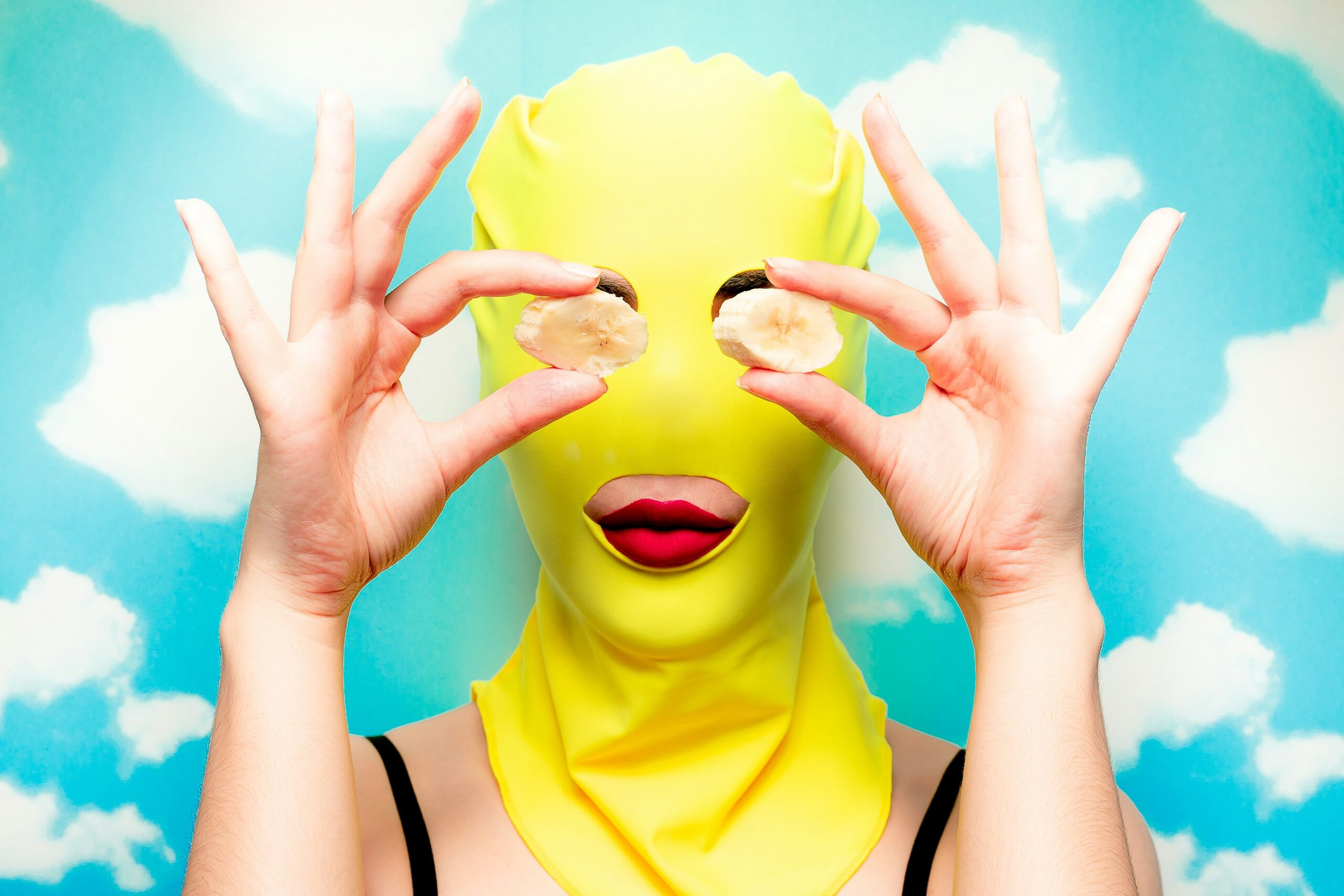 Homemade cucumber face mask being applied on someone's face