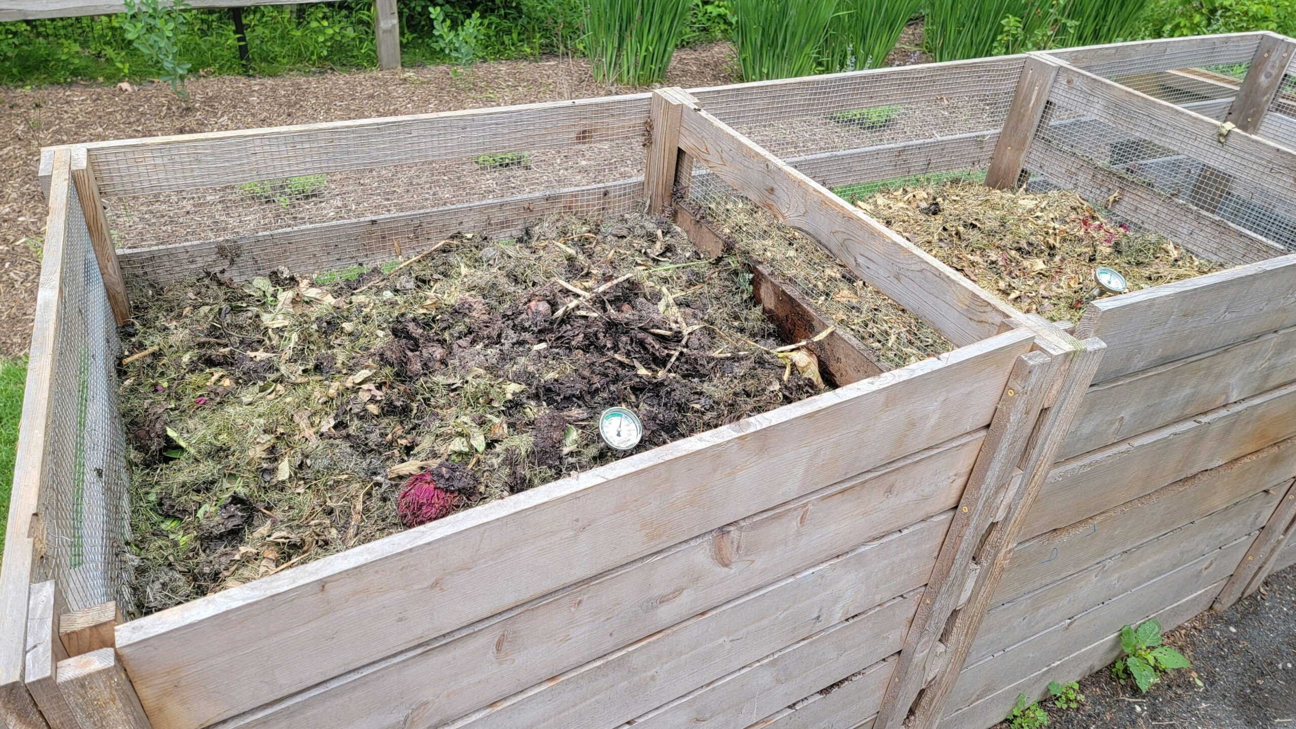 Illustration of hands holding rich soil from compost