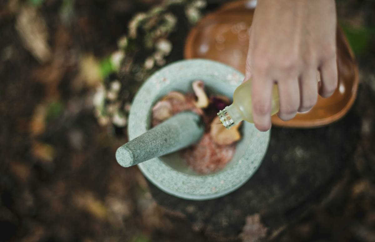 A conventional cucumber being sprayed with pesticide