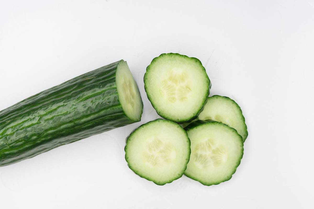 Side-by-side photos showing clearer, brighter skin after using fresh organic cucumber consistently.